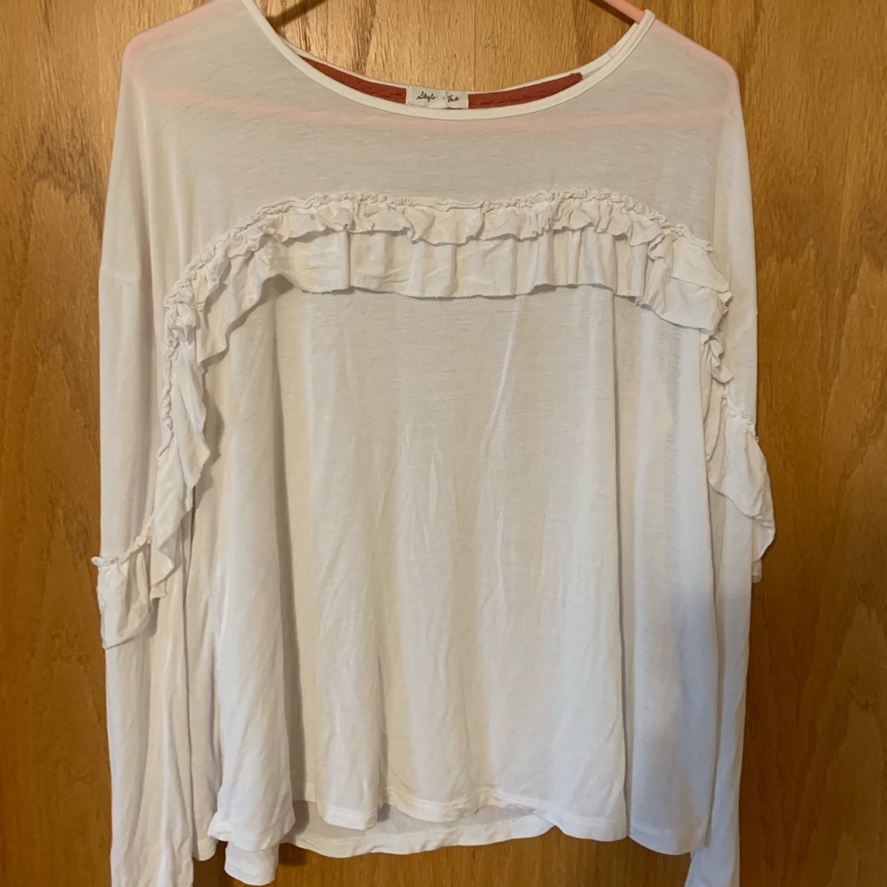 White long sleeve with ruffles.